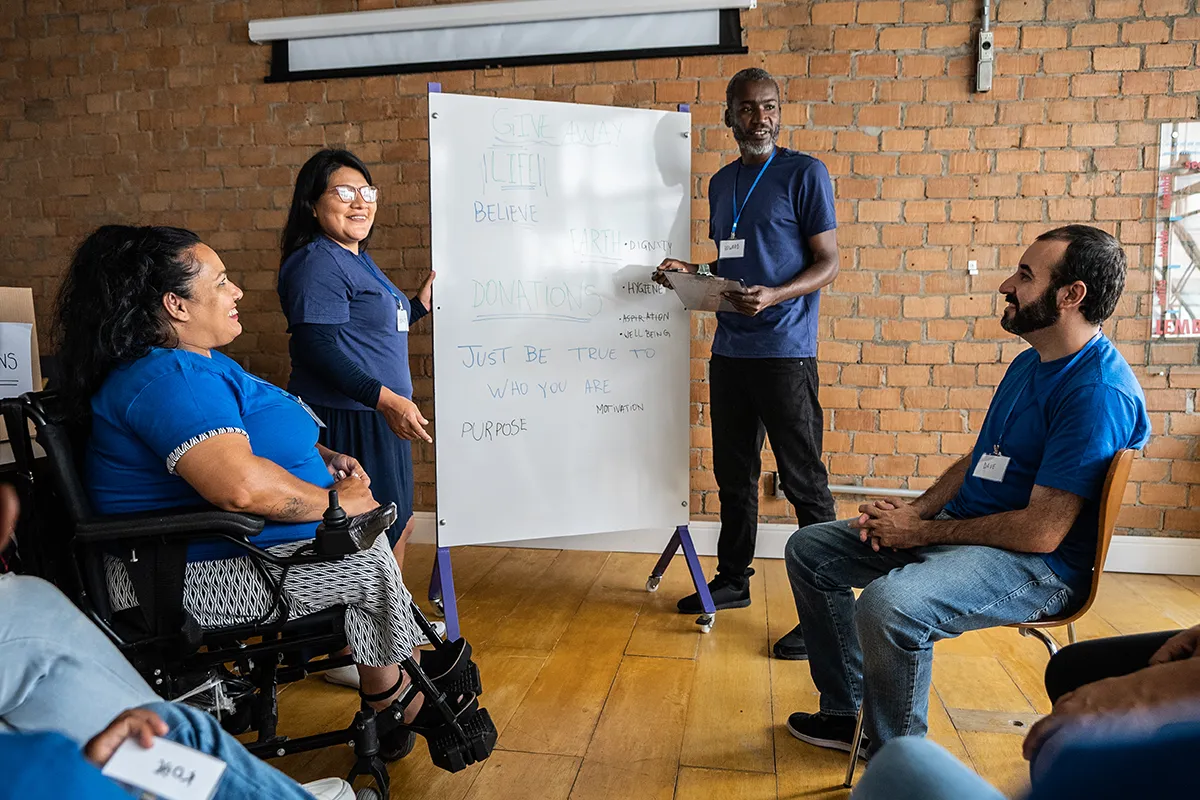 Volunteer manager teaching recruitment class of incoming volunteers. 