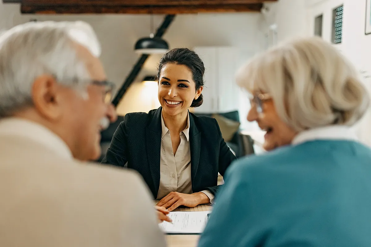 A financial advisor meets with a senior couple.